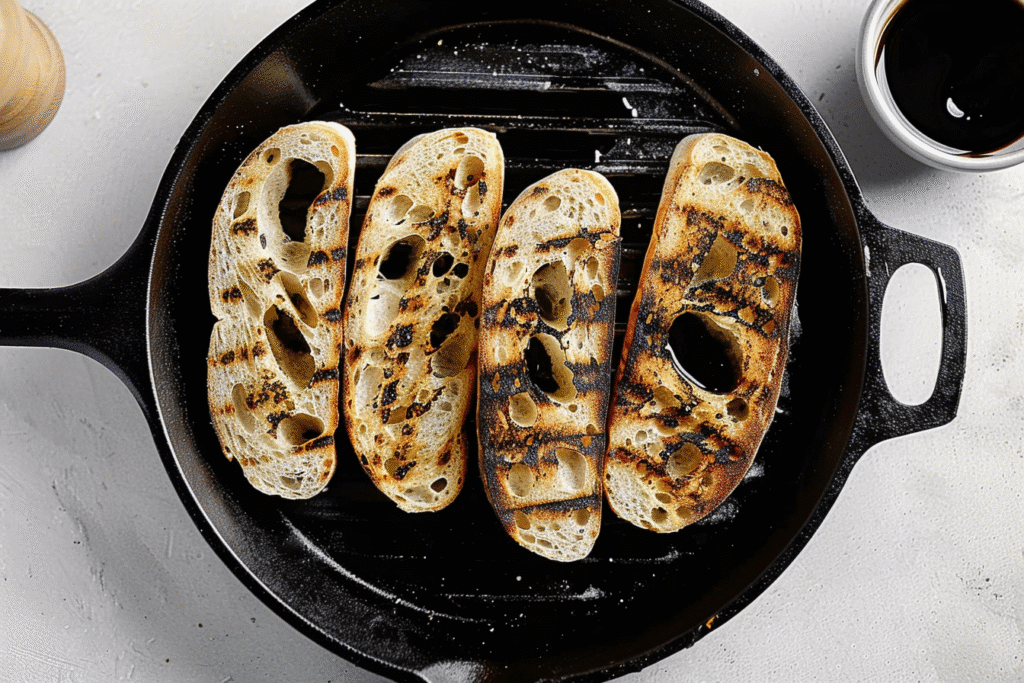Grilled Peach and Burrata Salad: Sweet, Creamy & Irresistible 13 grilled-bread-slices-cast-iron-pan
